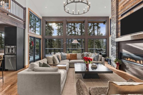 117 Silvertip Ridge, Canmore, AB - Indoor Photo Showing Living Room With Fireplace