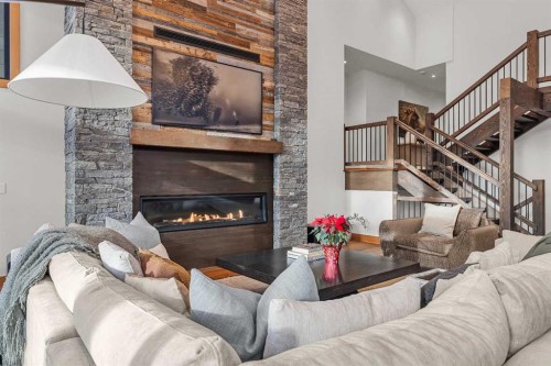 117 Silvertip Ridge, Canmore, AB - Indoor Photo Showing Living Room With Fireplace