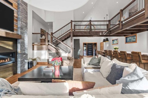 117 Silvertip Ridge, Canmore, AB - Indoor Photo Showing Living Room With Fireplace