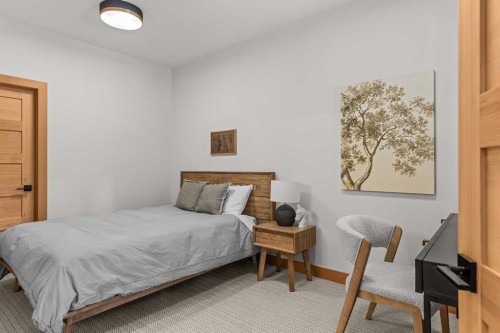 117 Silvertip Ridge, Canmore, AB - Indoor Photo Showing Bedroom