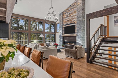 117 Silvertip Ridge, Canmore, AB - Indoor Photo Showing Other Room With Fireplace