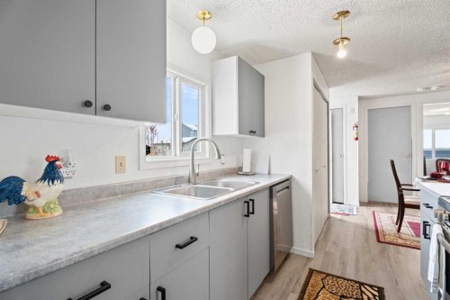 2 Westmount Drive, Cayley, AB - Indoor Photo Showing Kitchen With Double Sink