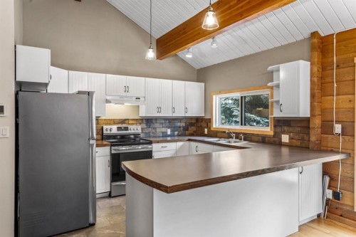 327 Silvertip Close, Canmore, AB - Indoor Photo Showing Kitchen With Double Sink
