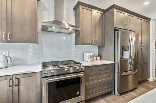 882 Bluerock Way Sw, Calgary, AB - Indoor Photo Showing Kitchen With Upgraded Kitchen