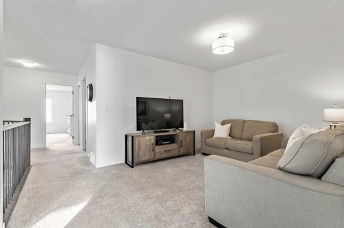 882 Bluerock Way Sw, Calgary, AB - Indoor Photo Showing Living Room