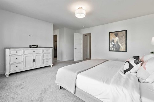 882 Bluerock Way Sw, Calgary, AB - Indoor Photo Showing Bedroom
