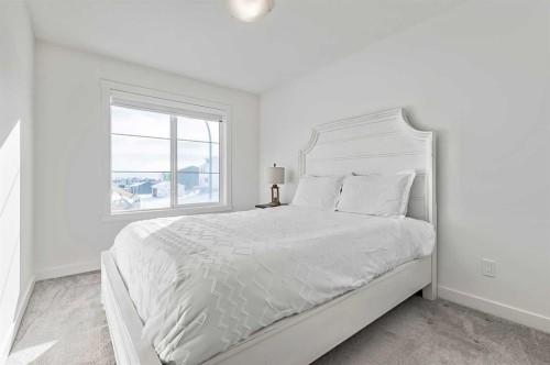 882 Bluerock Way Sw, Calgary, AB - Indoor Photo Showing Bedroom