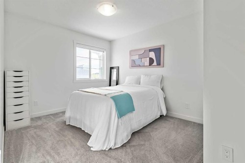 882 Bluerock Way Sw, Calgary, AB - Indoor Photo Showing Bedroom