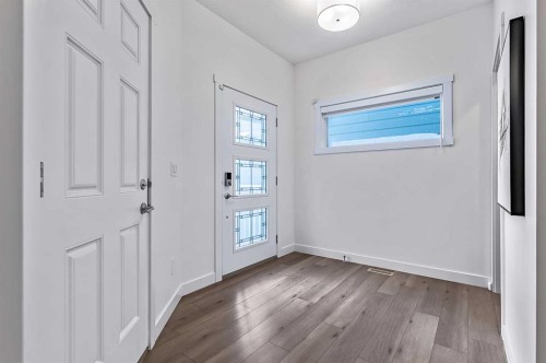 882 Bluerock Way Sw, Calgary, AB - Indoor Photo Showing Other Room