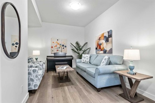 882 Bluerock Way Sw, Calgary, AB - Indoor Photo Showing Living Room