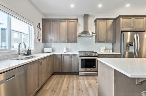 882 Bluerock Way Sw, Calgary, AB - Indoor Photo Showing Kitchen With Double Sink With Upgraded Kitchen