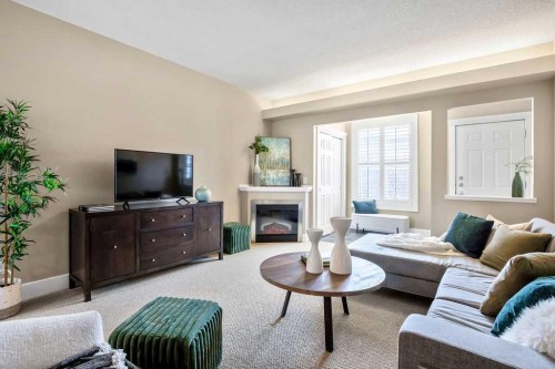 15-27 Springborough Boulevard Sw, Calgary, AB - Indoor Photo Showing Living Room With Fireplace