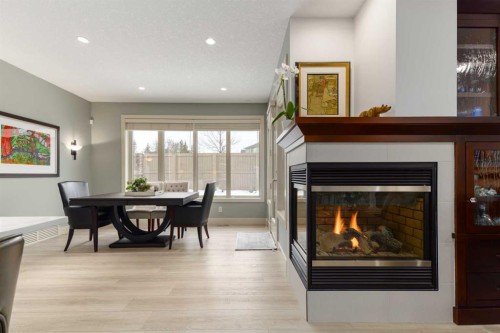 551 Evergreen Circle Sw, Calgary, AB - Indoor Photo Showing Other Room With Fireplace