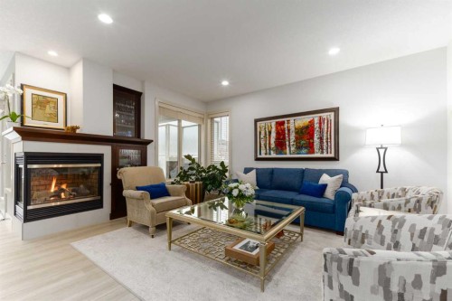551 Evergreen Circle Sw, Calgary, AB - Indoor Photo Showing Living Room With Fireplace