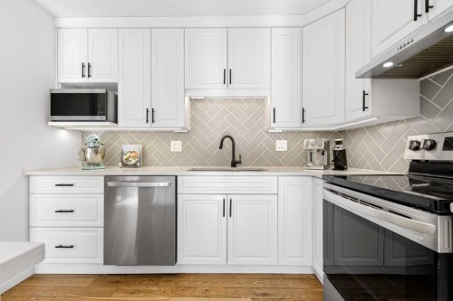 77 Point Drive Nw, Calgary, AB - Indoor Photo Showing Kitchen With Upgraded Kitchen