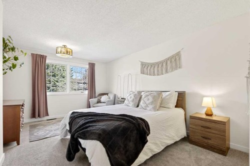 77 Point Drive Nw, Calgary, AB - Indoor Photo Showing Bedroom