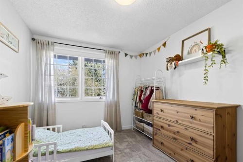 77 Point Drive Nw, Calgary, AB - Indoor Photo Showing Bedroom