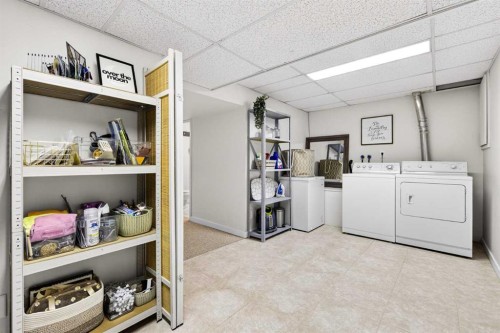 77 Point Drive Nw, Calgary, AB - Indoor Photo Showing Laundry Room