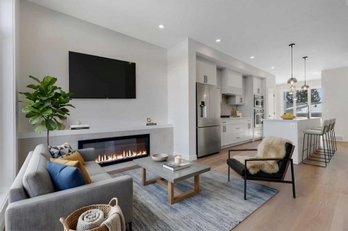 4307 30 Avenue Sw, Calgary, AB - Indoor Photo Showing Living Room With Fireplace