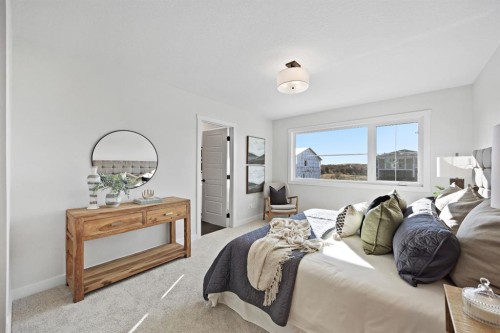 31 Fireside Common West, Cochrane, AB - Indoor Photo Showing Bedroom