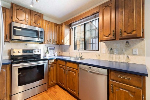 12 Castlefall Road Ne, Calgary, AB - Indoor Photo Showing Kitchen With Double Sink