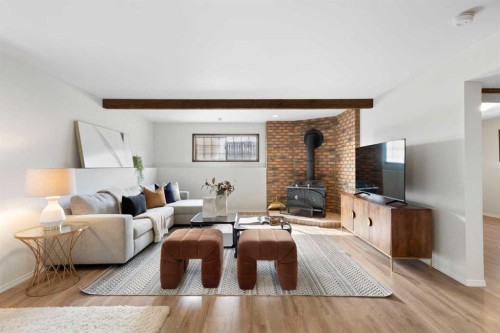 12 Castlefall Road Ne, Calgary, AB - Indoor Photo Showing Living Room With Fireplace