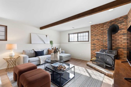 12 Castlefall Road Ne, Calgary, AB - Indoor Photo Showing Living Room With Fireplace