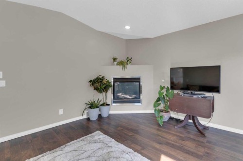 24 Evansbrooke Point Nw, Calgary, AB - Indoor Photo Showing Living Room With Fireplace