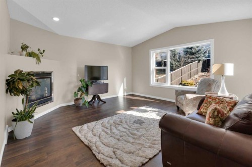 24 Evansbrooke Point Nw, Calgary, AB - Indoor Photo Showing Living Room With Fireplace