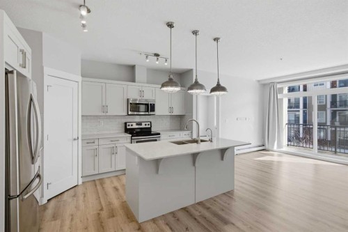 213-20 Walgrove Walk Se, Calgary, AB - Indoor Photo Showing Kitchen With Stainless Steel Kitchen With Double Sink With Upgraded Kitchen