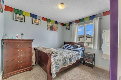 156 Bishop Crescent Nw, Langdon, AB - Indoor Photo Showing Bedroom