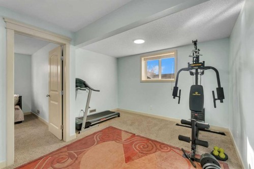 156 Bishop Crescent Nw, Langdon, AB - Indoor Photo Showing Gym Room