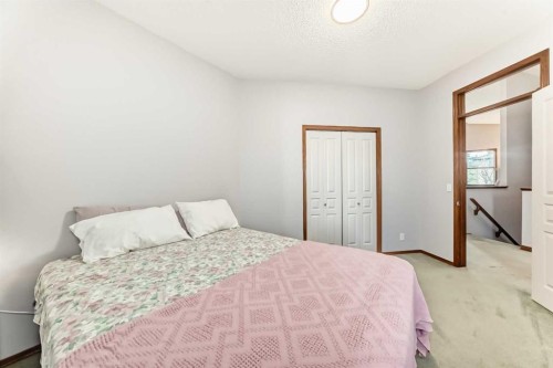 60 Hamptons Terrace Nw, Calgary, AB - Indoor Photo Showing Bedroom