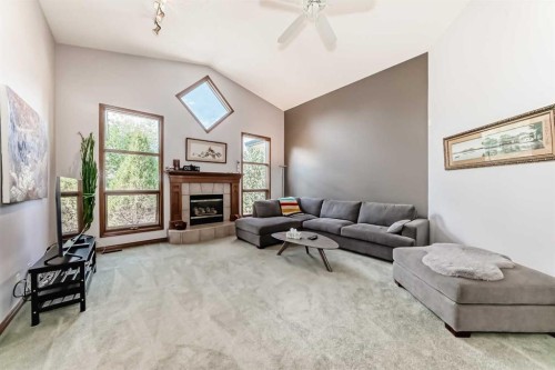 60 Hamptons Terrace Nw, Calgary, AB - Indoor Photo Showing Living Room With Fireplace