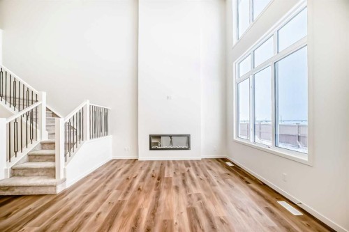 23 Bartlett Crescent Se, Calgary, AB - Indoor Photo Showing Other Room With Fireplace