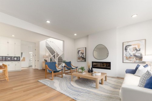 80 Creekside Path Sw, Calgary, AB - Indoor Photo Showing Living Room With Fireplace