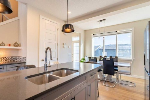 153 Waterford Boulevard, Chestermere, AB - Indoor Photo Showing Kitchen With Double Sink With Upgraded Kitchen