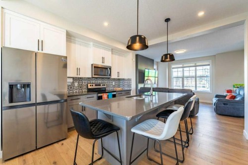 153 Waterford Boulevard, Chestermere, AB - Indoor Photo Showing Kitchen With Upgraded Kitchen
