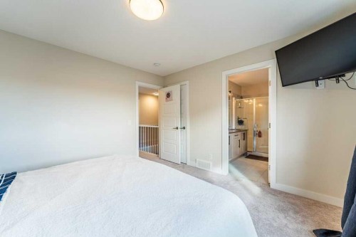 153 Waterford Boulevard, Chestermere, AB - Indoor Photo Showing Bedroom