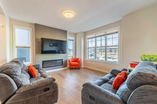 153 Waterford Boulevard, Chestermere, AB - Indoor Photo Showing Living Room With Fireplace