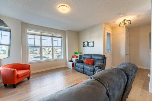 153 Waterford Boulevard, Chestermere, AB - Indoor Photo Showing Living Room