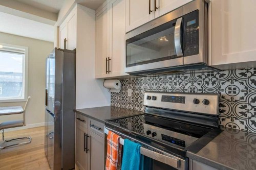 153 Waterford Boulevard, Chestermere, AB - Indoor Photo Showing Kitchen