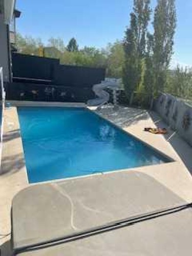 392 Rainbow Falls Way, Chestermere, AB - Outdoor With In Ground Pool