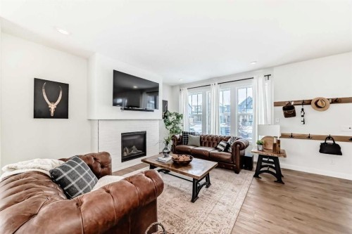 123 Harmony Circle, Rural Rocky View County, AB - Indoor Photo Showing Living Room With Fireplace