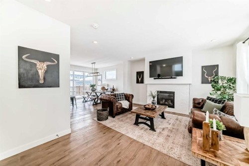 123 Harmony Circle, Rural Rocky View County, AB - Indoor Photo Showing Living Room With Fireplace