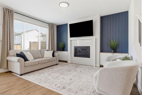 117 Ranchers View, Okotoks, AB - Indoor Photo Showing Living Room With Fireplace