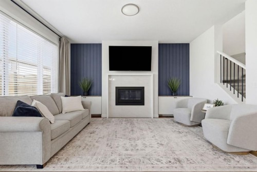 117 Ranchers View, Okotoks, AB - Indoor Photo Showing Living Room With Fireplace