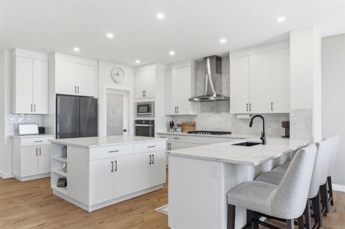 117 Ranchers View, Okotoks, AB - Indoor Photo Showing Kitchen With Upgraded Kitchen