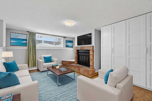8416 7 Street Sw, Calgary, AB - Indoor Photo Showing Living Room With Fireplace