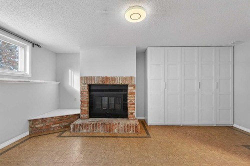 8416 7 Street Sw, Calgary, AB - Indoor Photo Showing Living Room With Fireplace